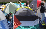 Illustrative: A Palestinian flag is displayed outside a tent at an anti-Israel protest encampment on the UCLA campus, April 26, 2024, in Los Angeles. (AP Photo/Damian Dovarganes)