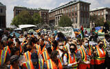 Columbia University faculty and staff gather on the campus in solidarity with student protesters who are demonstrating against the university's investments in Israel, April 29, 2024, in New York.  (AP Photo/Stefan Jeremiah)
