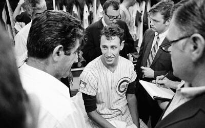 Chicago Cubs pitcher Ken Holtzman talks with reporters after a match against Atlanta in Chicago on August 19, 1969. (James Palmer/AP Photo)