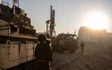 An IDF Combat Engineering truck-mounted drill rig is seen at Palestine Square in Gaza City's Rimal neighborhood, December 19, 2023. (Emanuel Fabian/Times of Israel) 
