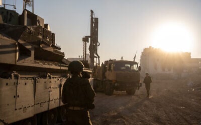 An IDF Combat Engineering truck-mounted drill rig is seen at Palestine Square in Gaza City's Rimal neighborhood, December 19, 2023. (Emanuel Fabian/Times of Israel) An IDF Combat Engineering truck-mounted drill rig is seen at Palestine Square in Gaza City's Rimal neighborhood, December 19, 2023. (Emanuel Fabian/Times of Israel)