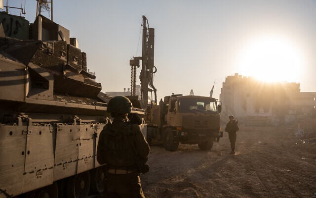 An IDF Combat Engineering truck-mounted drill rig is seen at Palestine Square in Gaza City's Rimal neighborhood, December 19, 2023. (Emanuel Fabian/Times of Israel) 