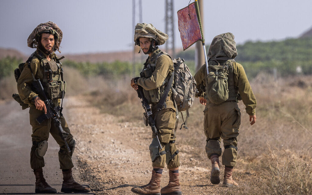 Illustrative: Soldiers from the IDF's Netzah Yehuda Battalion patrol near the Israeli-Gaza border, October 20, 2023. (Yonatan Sindel/Flash90) Illustrative: Soldiers from the IDF's Netzah Yehuda Battalion patrol near the Israeli-Gaza border, October 20, 2023. (Yonatan Sindel/Flash90)