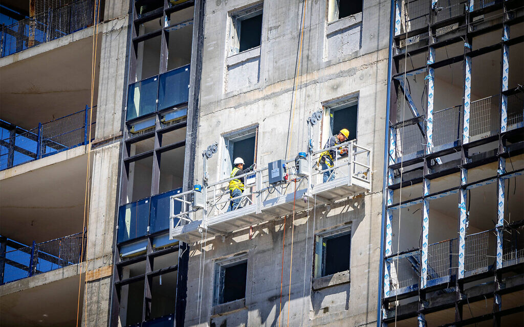 Illustrative: View of workers in a construction site in Jerusalem, March 5, 2024 (Yonatan Sindel/Flash90) Illustrative: View of workers in a construction site in Jerusalem, March 5, 2024 (Yonatan Sindel/Flash90)