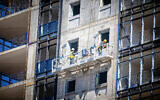 Illustrative: View of workers in a construction site in Jerusalem, March 5, 2024 (Yonatan Sindel/Flash90)
