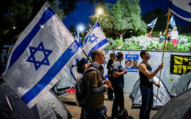 Demonstrators attend a protest against the government outside the Knesset in Jerusalem, April 1, 2024. (Arie Leib Abrams/ Flash90) Demonstrators attend a protest against the government outside the Knesset in Jerusalem, April 1, 2024. (Arie Leib Abrams/ Flash90)