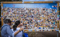 Family members visit the site of the Supernova music festival massacre, six month after the October 7 Hamas terror assault, in Re'im forest, near the Gaza border, April 7, 2024. (Chaim Goldberg/Flash90)
