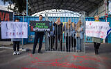 Likud MK Boaz Bismuth and activists protest against United Nations Relief and Works Agency for Palestine Refugees (UNRWA) outside their offices in Jerusalem, April 9, 2024. (Yonatan Sindel/Flash90)