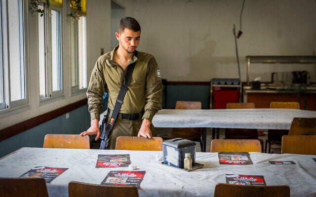 Soldiers at a pre-Passover event in the Kibbutz Nir Oz dining hall on April 11, 2024. (Liron Moldovan/Flash90) Soldiers at a pre-Passover event in the Kibbutz Nir Oz dining hall on April 11, 2024. (Liron Moldovan/Flash90)