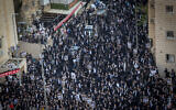 Thousands of ultra-Orthodox men protest against the drafting of Haredim to the IDF, Jerusalem, April 11, 2024. (Yonatan Sindel/Flash90)