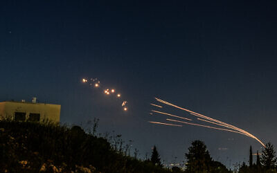 Illustrative: The Iron Dome air defense system intercepts rockets fired from Lebanon, as seen over the Hula Valley, April 12, 2024. (Ayal Margolin/Flash90)