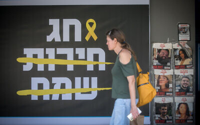 A sign reading 'Happy Freedom Holiday' refers to Passover, with the words 'Happy' and 'Freedom' crossed out, in Tel Aviv, April 16, 2024 (Photo by Miriam Alster/Flash90) A sign reading 'Happy Freedom Holiday' refers to Passover, with the words 'Happy' and 'Freedom' crossed out, in Tel Aviv, April 16, 2024 (Photo by Miriam Alster/Flash90)