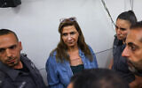 Professor Nadera Shalhoub-Kevorkian, an Arab citizen of Israel who was arrested on suspicion of incitement amid the war in Gaza, arrives for a court hearing at the Jerusalem Magistrate's Court, April 19, 2024. (Chaim Goldberg/Flash90)