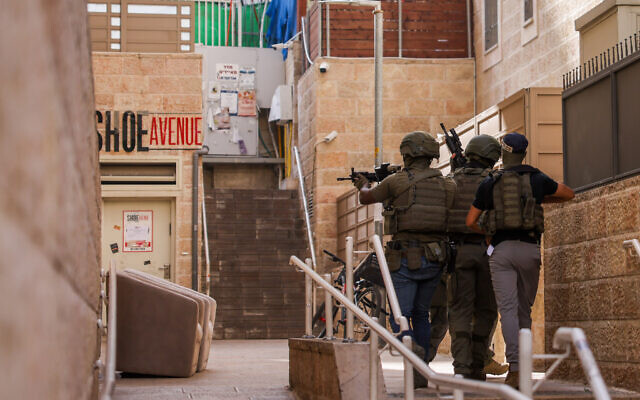 Police special forces looking for the terrorists who carried out a car-ramming terror attack in Jerusalem, hours before the start of the Passover holiday, April 22, 2024. (Chaim Goldberg/Flash90) Police special forces looking for the terrorists who carried out a car-ramming terror attack in Jerusalem, hours before the start of the Passover holiday, April 22, 2024. (Chaim Goldberg/Flash90)