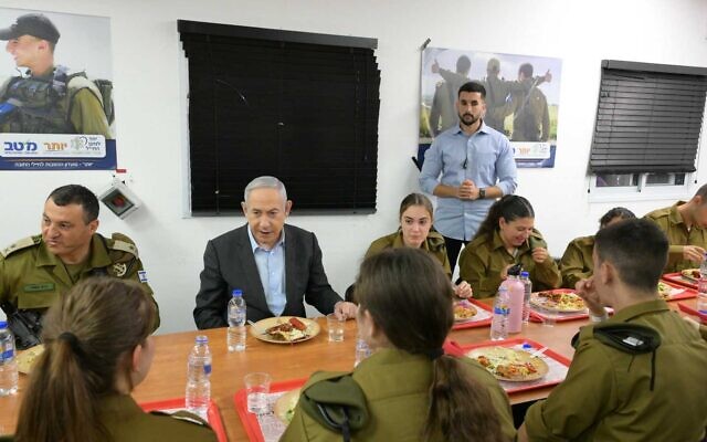 Prime Minister Benjamin Netanyahu meets with new recruits drafting to the IDF's Border Defense Corps at the Tel Hashomer military base, April 9, 2024. (Amos Ben Gershom/GPO)