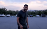 File: Iranian rapper Toomaj Salehi in the music video for his protest song 'Mouse Hole,' uploaded to YouTube on July 28, 2021. (Screen capture: YouTube/Toomaj Salehi, used in accordance with Clause 27a of the Copyright Law)