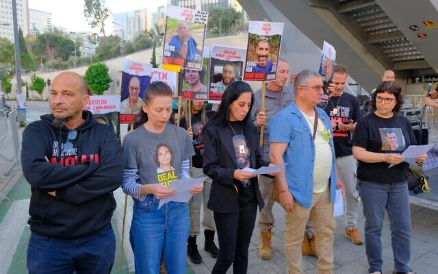 Members of the Mozes, Metzger, Calderon, Sangauker, Elgarat, and Monder families of hostages deliver a statement to the press in front of the Begin Gate at the Kirya IDF Military Headquarters in Tel Aviv on April 6, 2024. Einav Zangauker is at center. (Adar Eyal / Pro-Democracy Protest Movement)
