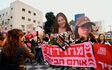 Large images of hostages Naama Levy and Liri Albag are held above the crowd as protesters in Tel Aviv call for a hostage deal, April 11, 2024. (Danor Aharon/ Pro-Democracy Protest Movement)