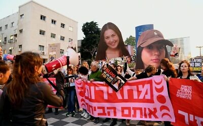 Large images of hostages Naama Levy and Liri Albag are held above the crowd as protesters in Tel Aviv call for a hostage deal, April 11, 2024. (Danor Aharon/ Pro-Democracy Protest Movement)