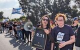 Participants in the Let My People Go march hold posters of all the dates that the hostages have been held in captivity by Hamas in Gaza, on April 12, 2024. (Tanya Zion-Waldoks)