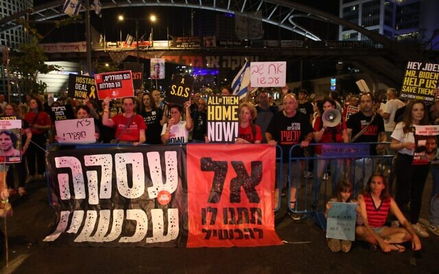 Families of some hostages held by Hamas in Gaza, and supporters, block part of Tel Aviv's Begin Street to demand a deal to immediately free the hostages, April 23, 2024. (Ilan Faigenbaum/Pro-Democracy Protest Movement) Families of some hostages held by Hamas in Gaza, and supporters, block part of Tel Aviv's Begin Street to demand a deal to immediately free the hostages, April 23, 2024. (Ilan Faigenbaum/Pro-Democracy Protest Movement)