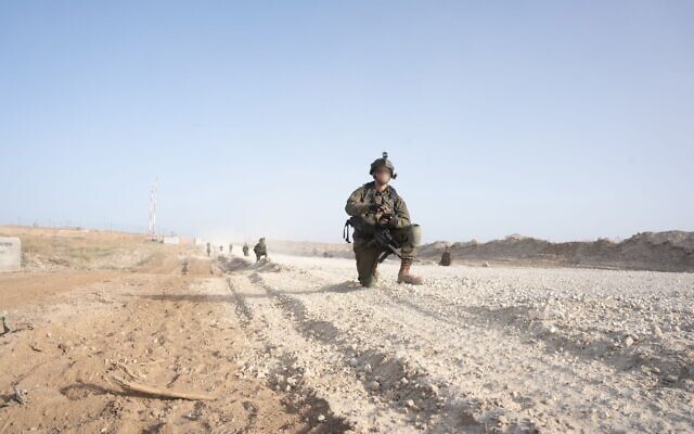 Troops of the Nahal Brigade are seen in the Netzarim corridor, central Gaza, in a handout image published April 25, 2024. (Israel Defense Forces)