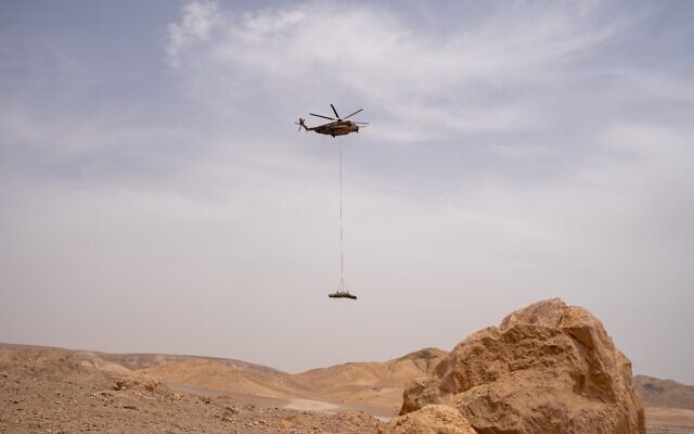 An IAF helicopter removes the remains of an Iranian ballistic missile that was found by hikers near Arad, April 26, 2024. (Israel Defense Forces) An IAF helicopter removes the remains of an Iranian ballistic missile that was found by hikers near Arad, April 26, 2024. (Israel Defense Forces)
