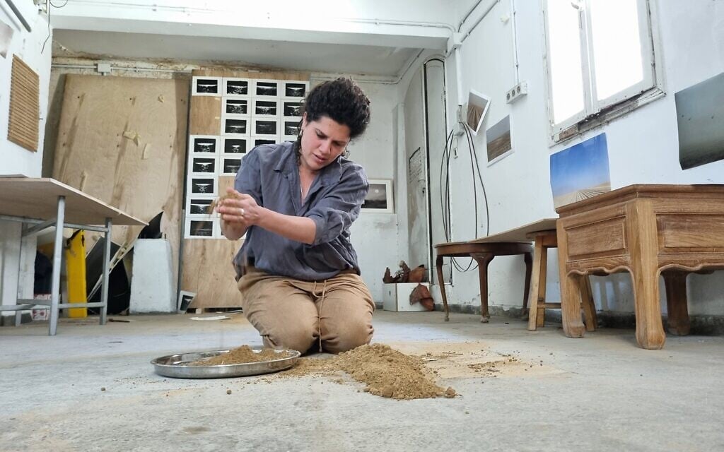 Brit Einstein brought earth from the  Kibbutz Magen potato fields to create a series of art pieces. (Bernard Dichek)