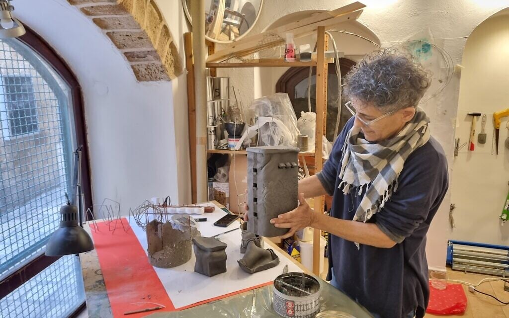 Artist Nadine Bar-Noy and 'No Way to Build A Home,' a mixed-media work . (Bernard Dichek)