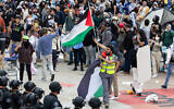 Police officers clash with pro-Palestinian, anti-Israel demonstrators at the University of California at Irvine (UCI) on May 15, 2024 in Irvine, California. (Qian Weizhong/VCG via Getty Images, via JTA)