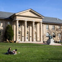 Cornell University students sit outside on November 3, 2023, in Ithaca, New York. (Matt Burkhartt/ Getty Images/ AFP)