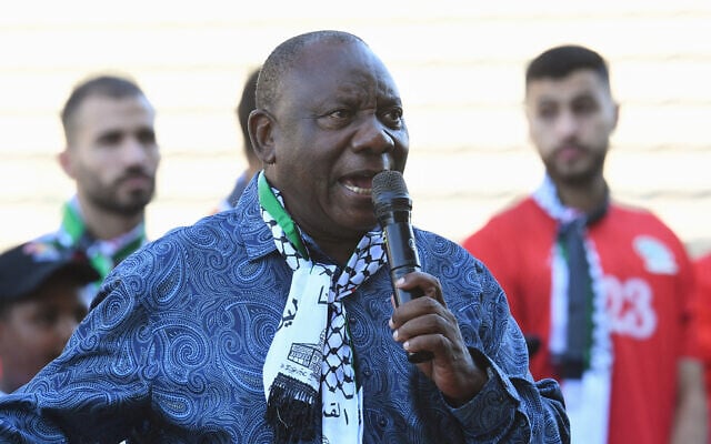 South African President Cyril Ramaphosa, wearing a keffiyah scarf, speaks before an exhibition football match between Western Cape XI and the Palestinian national football team at Athlone Stadium in Athlone, near Cape Town, on February 11, 2024. (Rodger Bosch/AFP) South African President Cyril Ramaphosa, wearing a keffiyah scarf, speaks before an exhibition football match between Western Cape XI and the Palestinian national football team at Athlone Stadium in Athlone, near Cape Town, on February 11, 2024. (Rodger Bosch/AFP)