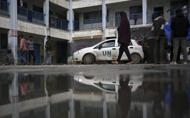 Displaced Palestinians take shelter in a school run by the United Nations Relief and Works Agency for Palestine Refugees (UNRWA), in Rafah in the southern Gaza Strip on March 3, 2024 (AFP)