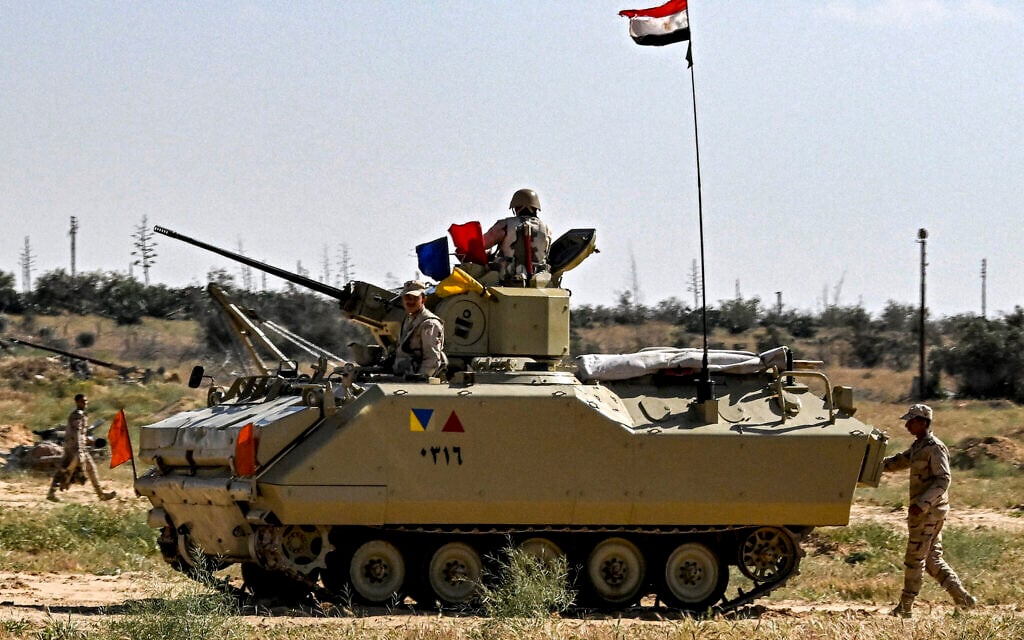 Egyptian army soldiers man an infantry fighting vehicle (IFV) deployed near the Egyptian side of the Rafah Border Crossing with the Gaza Strip on March 23, 2024 (Photo by Khaled DESOUKI / AFP) Egyptian army soldiers man an infantry fighting vehicle (IFV) deployed near the Egyptian side of the Rafah Border Crossing with the Gaza Strip on March 23, 2024 (Photo by Khaled DESOUKI / AFP)