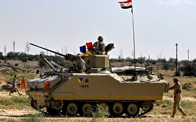 Egyptian army soldiers man an infantry fighting vehicle (IFV) deployed near the Egyptian side of the Rafah Border Crossing with the Gaza Strip on March 23, 2024 (Photo by Khaled DESOUKI / AFP)