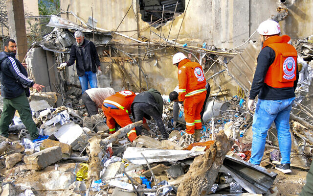 People inspect destruction at the site of an overnight Israeli airstrike in Habariyeh near the Israeli border on March 27, 2024. (Photo by Rabih DAHER / AFP) People inspect destruction at the site of an overnight Israeli airstrike in Habariyeh near the Israeli border on March 27, 2024. (Photo by Rabih DAHER / AFP)