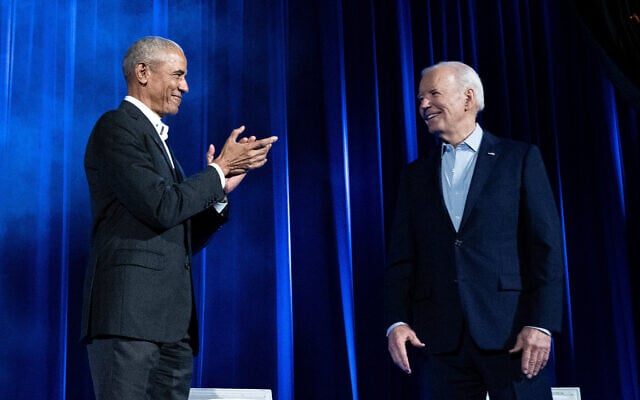 File - Former US president Barack Obama (L) claps for US President Joe Biden during a campaign fundraising event at Radio City Music Hall in New York City on March 28, 2024. (Brendan Smialowski/AFP)