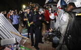 Police breach the pro-Palestinian, anti-Israel encampment at the campus of the University of California, Los Angeles (UCLA) in Los Angeles, California, early on May 2, 2024. (Etienne Laurent/AFP)