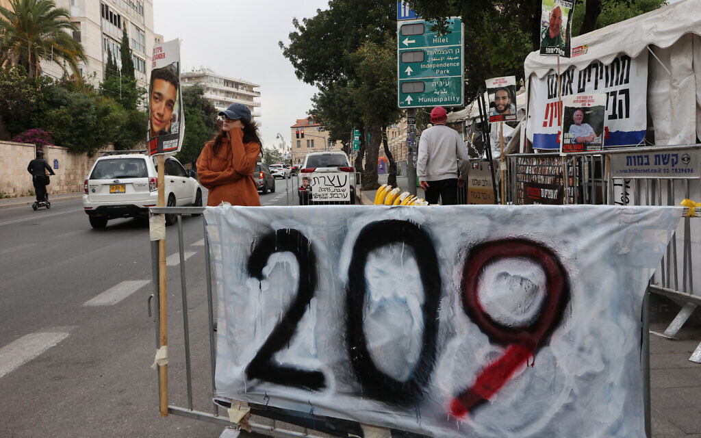 Relatives of Gaza hostages set up large banners and placards calling for their release during a protest in front of the Prime Minister's Residence in Jerusalem on May 2, 2024. (Gil Cohen-Magen / AFP)