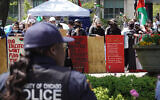 Illustrative: Campus police stand between demonstrators at a pro-Palestinian, anti-Israel encampment on the campus of the University of Chicago and counter demonstrators after a brief skirmish between the groups on May 3, 2024 in Chicago, Illinois. (Scott Olson/Getty Images/AFP)