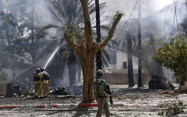 Security forces and emergency personnel deploy at a site hit by rocket fire from south Lebanon toward Kiryat Shmona near the Lebanese border on May 5, 2024 (Jalaa MAREY / AFP)