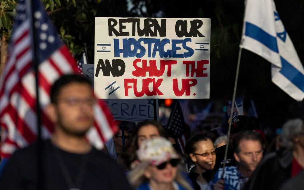 Supporters of Israel participate in a "United for Israel" march around the University of Southern California in Los Angeles, California on May 8, 2024. (Photo by Etienne LAURENT / AFP)