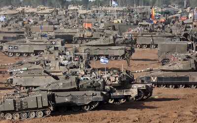 Illustrative: IDF tanks are positioned in southern Israel near the border with the Gaza Strip on May 9, 2024. (Ahmad Gharabli/AFP)