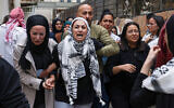 Mourners and relatives cry during the funeral of Palestinian Ayser Mohammad Safi, in Ramallah in the West Bank on May 15, 2024. (JAAFAR ASHTIYEH / AFP)