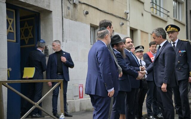France's Minister for Interior and Overseas Gerald Darmanin (2nd R) is welcomed by Rabbin Chmouel Lubecki as he arrives at the synagogue in the Normandy city of Rouen on May 17, 2024, where French police shot dead earlier a man armed with a knife and a crowbar who was setting fire to the building. (Lou Benoist/AFP) France's Minister for Interior and Overseas Gerald Darmanin (2nd R) is welcomed by Rabbin Chmouel Lubecki as he arrives at the synagogue in the Normandy city of Rouen on May 17, 2024, where French police shot dead earlier a man armed with a knife and a crowbar who was setting fire to the building. (Lou Benoist/AFP)