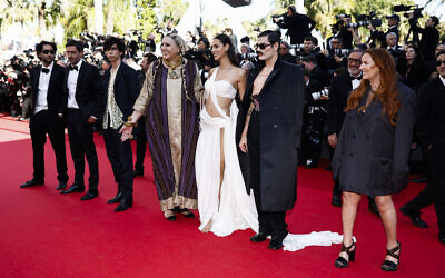 French director and screenwriter Yolande Zauberman (R), French Lucky Love (R), Israeli actress Talleen Abu Hanna (3rd R), Israeli actress Israela (C) arrive for the screening of the film 'La belle de Gaza' at the 77th edition of the Cannes Film Festival in Cannes, southern France, on May 17, 2024. (Sameer Al-Doumy / AFP)