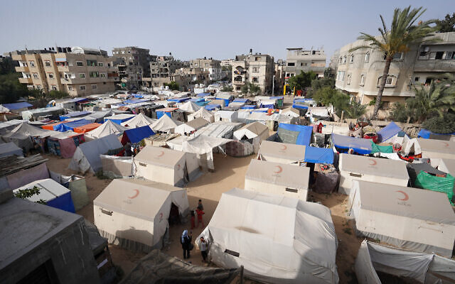 A makeshift shelter housing displaced Palestinians in Deir el-Balah in the central Gaza Strip on May 18, 2024. (AFP) A makeshift shelter housing displaced Palestinians in Deir el-Balah in the central Gaza Strip on May 18, 2024. (AFP)