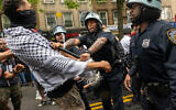 Pro-Palestinian, anti-Israel protesters confront police during a Nakba Day rally and march on May 18, 2024 in the Bay Ridge section of Brooklyn, New York. (Spencer Platt/ Getty Images/ AFP)