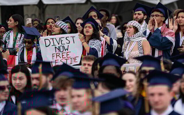 Graduating students protest against Israel during George Washington University's graduation ceremony on the National Mall on May 19, 2024 in Washington, DC. (Andrew Thomas/AFP) Graduating students protest against Israel during George Washington University's graduation ceremony on the National Mall on May 19, 2024 in Washington, DC. (Andrew Thomas/AFP)