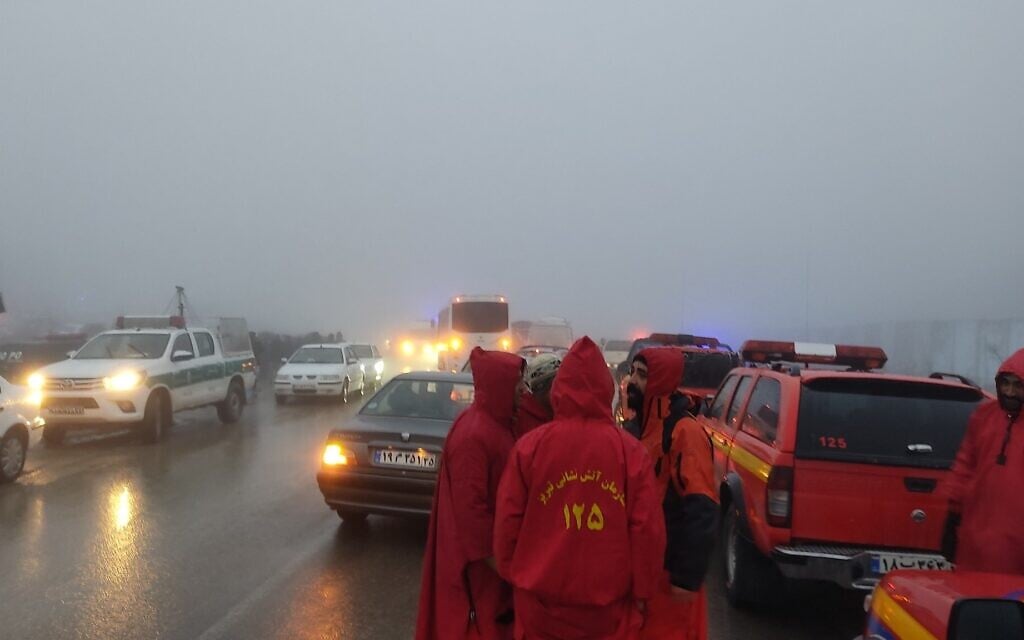 In this photo provided by MojNews on May 19, 2024, rescuers gather before heading towards the site of the "accident" involving a helicopter in the convoy of Iran's President Ebhraim Raisi in the Jolfa region of the western province of East Azerbaijan. (Photo by Azin Haghighi/MojNews/AFP)